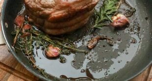 frying pan with piece of meat